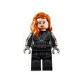 Minifigure with red hair and a black outfit, featuring a serious expression and detailed design.