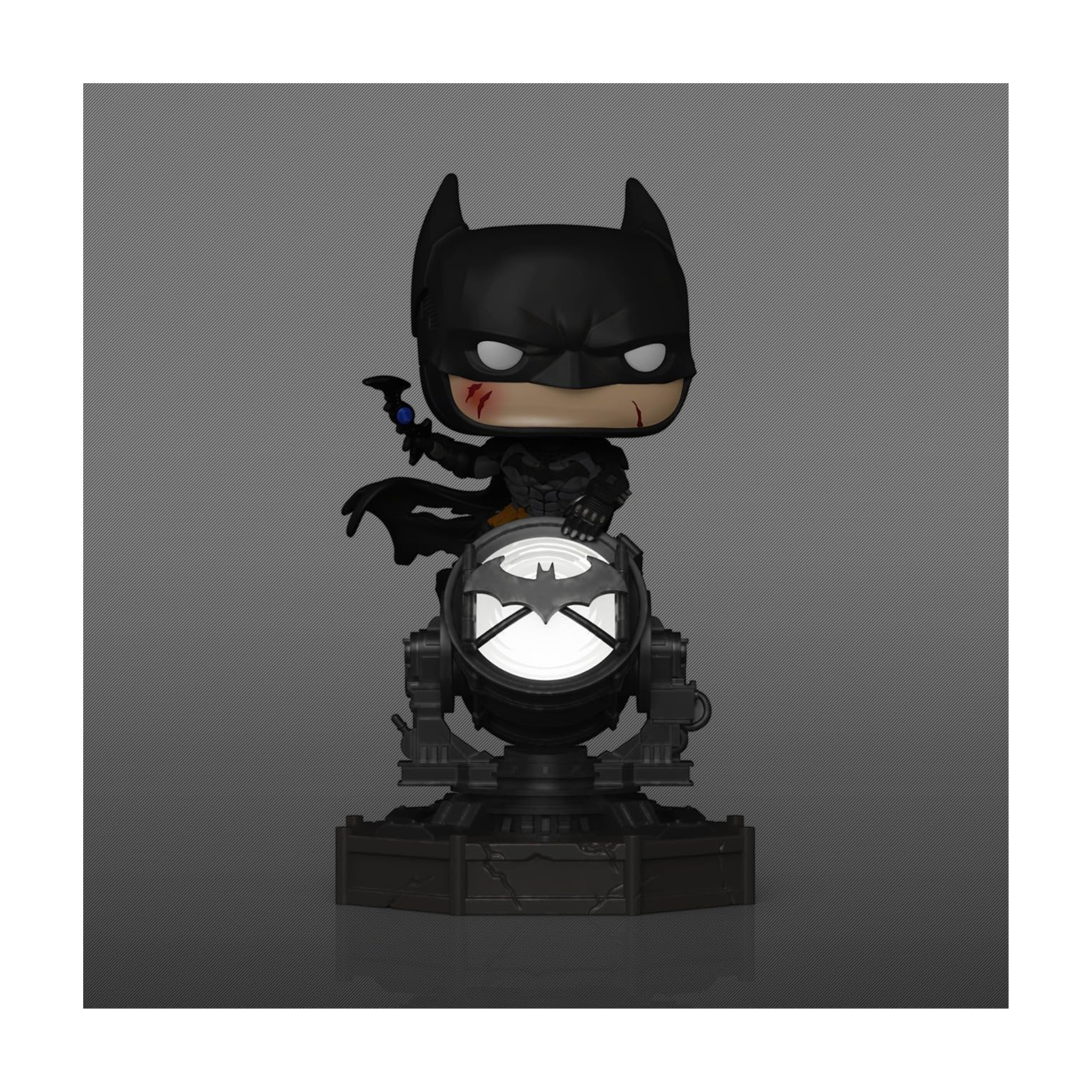 Batman from Arkham Knight Funko Pop Deluxe figure standing on a spotlight base with a bat symbol, featuring a serious expression.