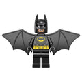 Minifigure featuring a bat-themed design with black wings, a black headband, and a smiling face with yellow accents.