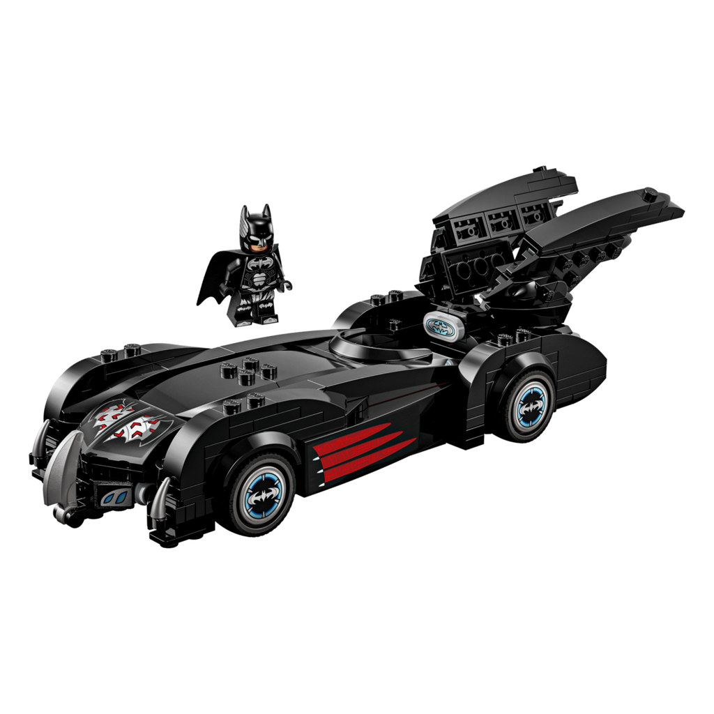 Batmobile model with black body and red accents, featuring an open hood and Batman figure, typical of LEGO sets.
