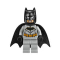 Batman minifigure with a dark bluish gray suit, gold belt, black hands, and spongy black cape.