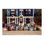LEGO minifigures from Stranger Things in front of a detailed blue house with white trim and multiple windows.