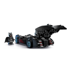 Batmobile model in black with blue accents alongside a Batman figure in a black suit with a cape and mask.