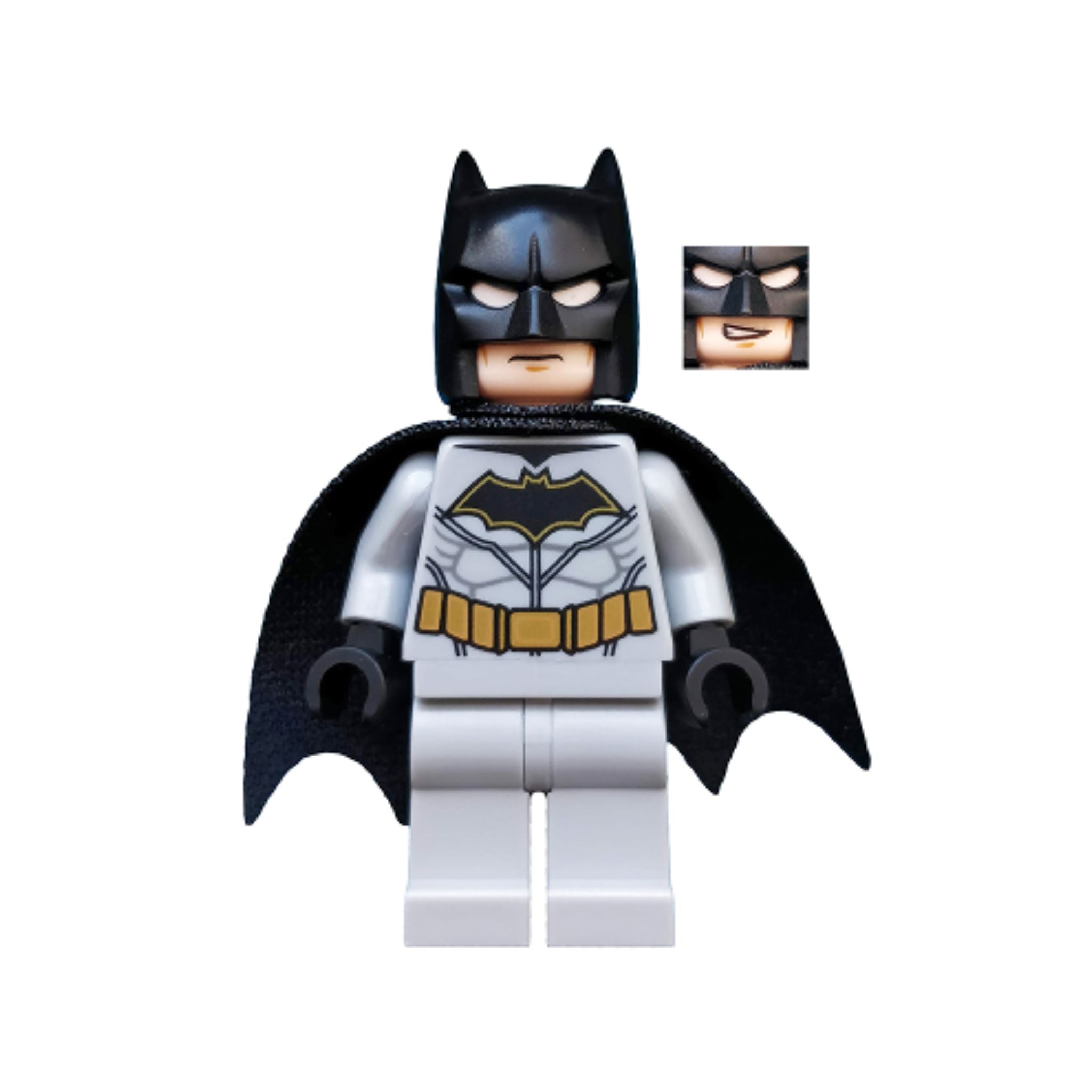 Batman minifigure with a black cape, gray body, and bat emblem, featuring a black mask and alternate facial expression.